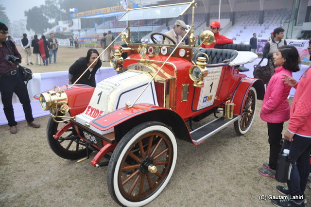 1906 Renault Freres, 8 Horsepower (HP), 2 cylinders flashing red as a youngster waiting to touch her  at Kolkata, West Bengal, India by Gautam Lahiri