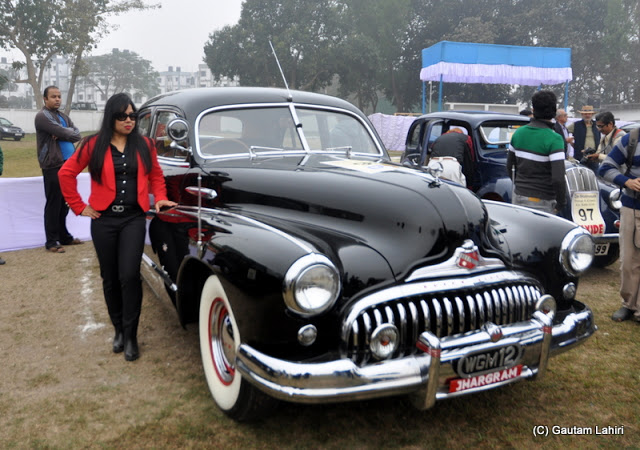 1948 Buick Super 8, the beefy American muscle car of yesteryears, stood resplendent in her black clothing  at Kolkata, West Bengal, India by Gautam Lahiri