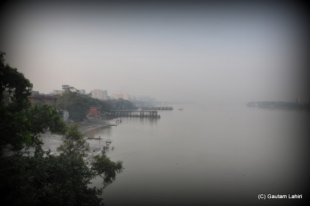Ever busy jetties of Outram ghat await the first whistles of the giant floating people carriers  at Kolkata, West Bengal, India by Gautam Lahiri