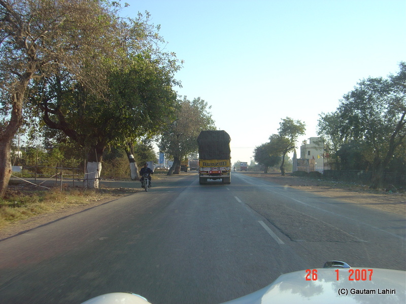 A single truck was all that remained in front of us. The broad road was too inviting to step on the gas which we did to cover the 257 kilometers to Kisli towards Kanha forest reserve by Gautam Lahiri