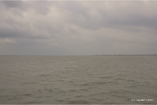 The formidable looking Matla river stretched miles into the horizon as we made our way over the rough waves towards 'Jharkhali'  at Sunderbans National Park, West Bengal, India by Gautam Lahiri