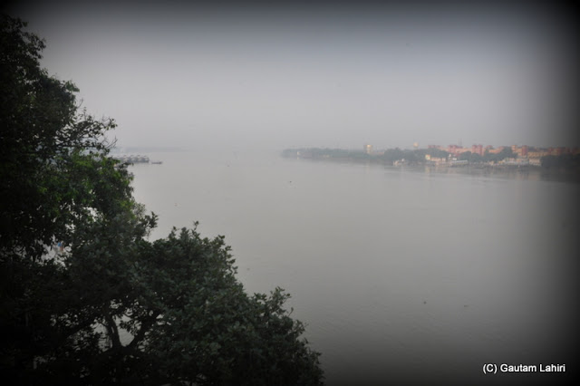 The Hooghly river calmly flows and patiently awaits the big ferries that will cross her when Calcutta and Howrah want to connect  at Kolkata, West Bengal, India by Gautam Lahiri