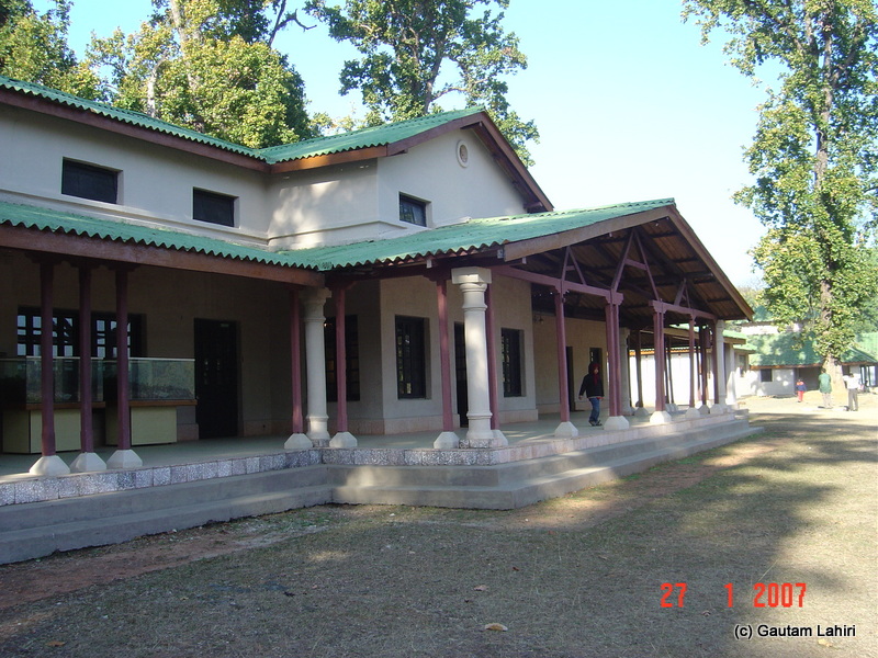 Main entrance to the Kanha museum remained under shadows of gigantic trees within Kanha forest by Gautam Lahiri