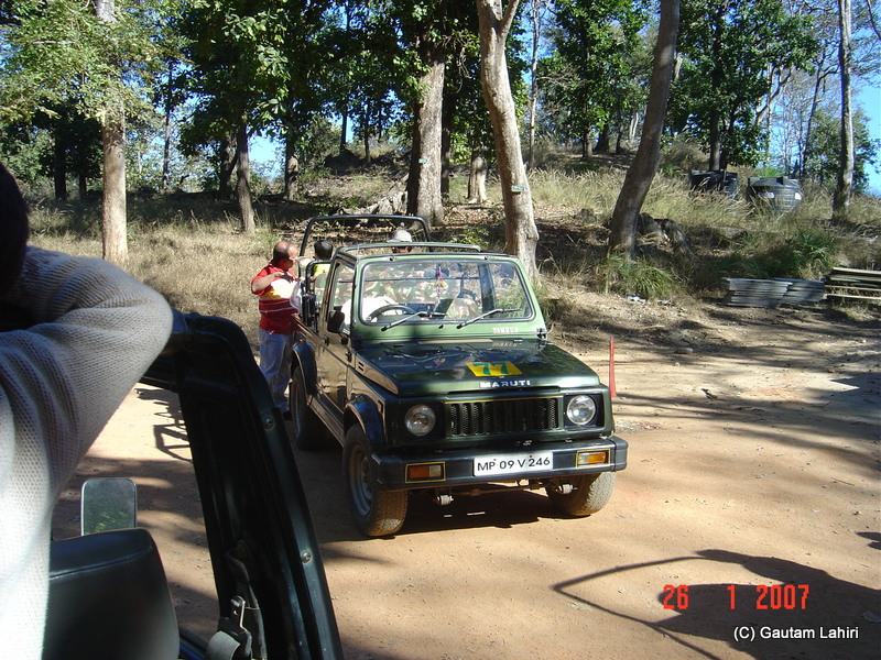 We set off with people and vehicles in search of the wild animals of Kanha forest by Gautam Lahiri