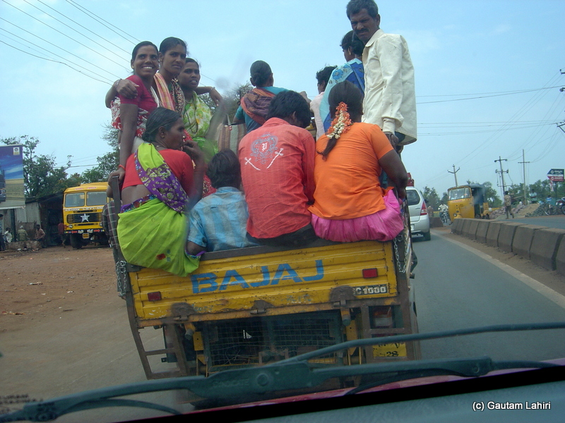 Perched on top of a 2 inches wide metal frame, about twenty people merrily sat and swayed as the notorious three wheelers made valiant attempts to carry on and competed with the cars as we neared the town of Bidar from Hyderabad by Gautam Lahiri