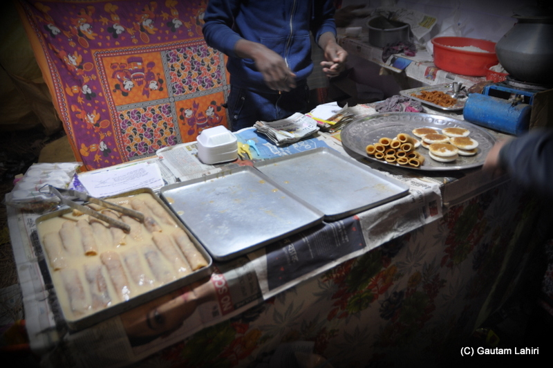 'Pithe' on offer, taste from the heavens at Santiniketan, West Bengal, India by Gautam Lahiri
