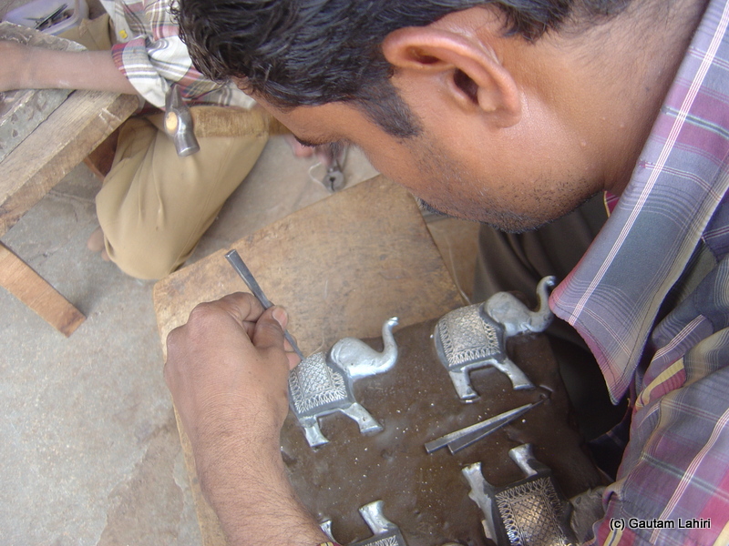 Intricate elephant motifs were being hued as the hammer and chisel made precise contact at the intended spot on the metal base. Absolutely, no room for error at Bidar by Gautam Lahiri