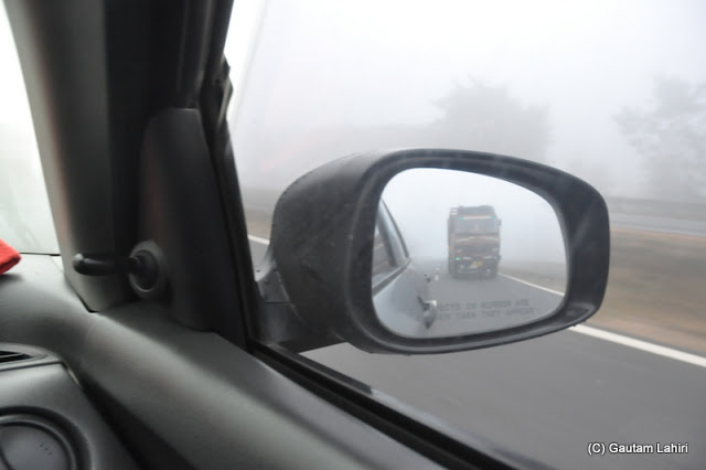 With the cloak of smog around us, we pierced it to through NH-2 towards Santiniketan, West Bengal, India by Gautam Lahiri