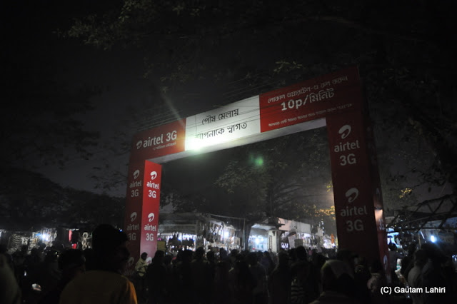 Santiniketan Fair entrance stands tall among million heads, West Bengal, India by Gautam Lahiri