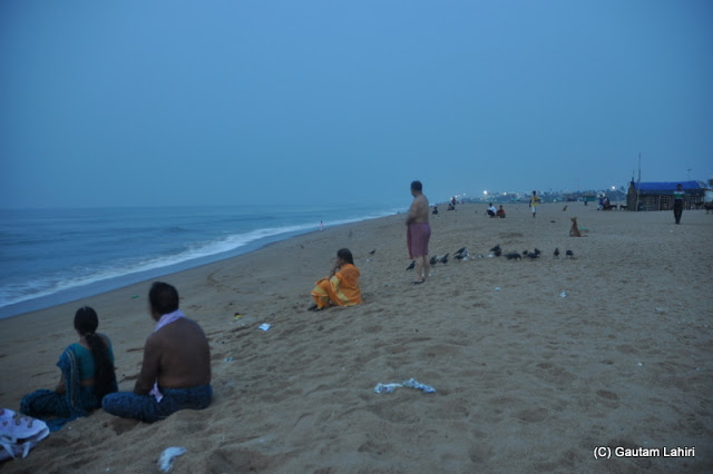 Many of us slowly joined us to view the cooler aspect of the sea  at Puri, Bhubaneshwar, Odisha, India by Gautam Lahiri