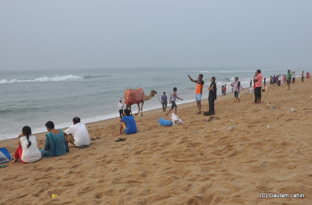 Early morning light catching the sea bathers as the environment is near ideal to hit the sea  at Puri, Bhubaneshwar, Odisha, India by Gautam Lahiri
