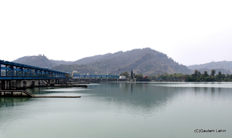 The calm waters of the reservoir bordered by the small hills, Chilla dam by gautam lahiri