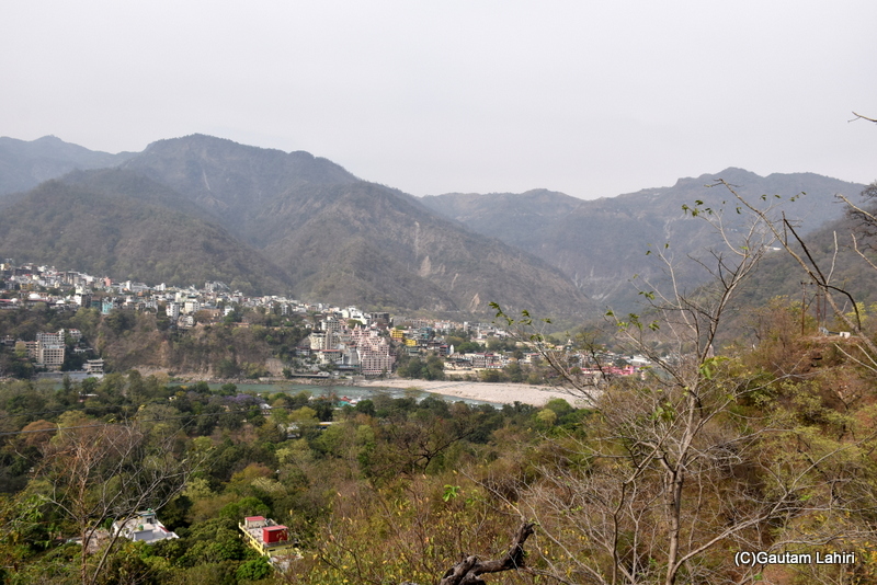 We turned a corner, and the town of Rishikesh lay scattered over the adjoining hills by gautam lahiri