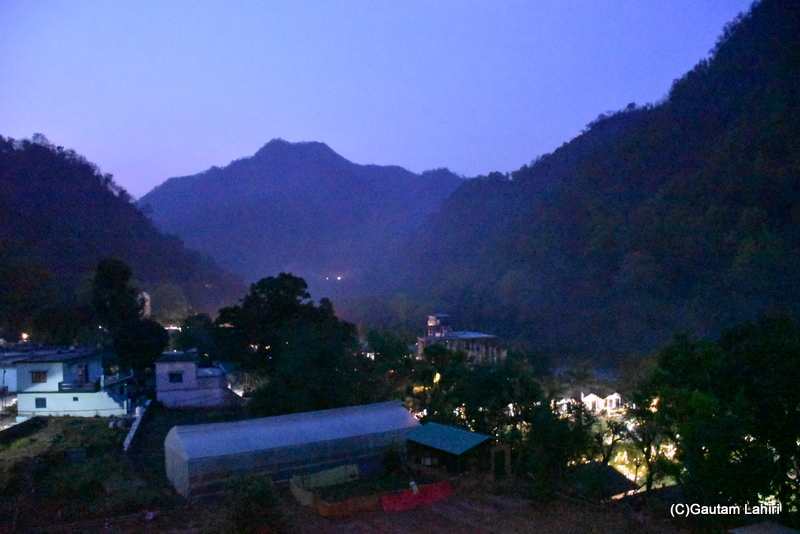 As we settled for the night, the dusk shrouded the hills of Rishikesh. The streaks of light from the houses created an eerie glow by gautam lahiri
