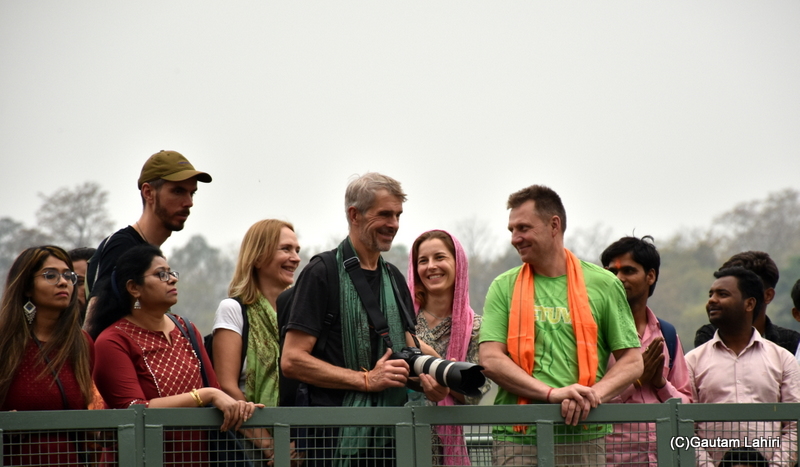 people who could not sit, thronged the bridges on the ghat at Rishikesh by gautam lahiri