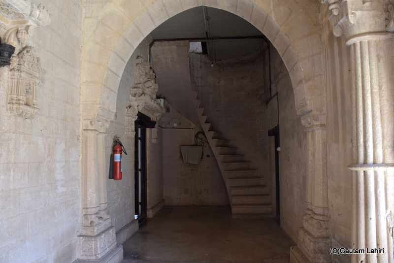 The Gothic-style pillars guided us toward a grand arched entrance. A winding staircase led to a foyer adjoining a lavishly adorned sitting room for guests at the Naulakha Palace in Gondal by gautam lahiri