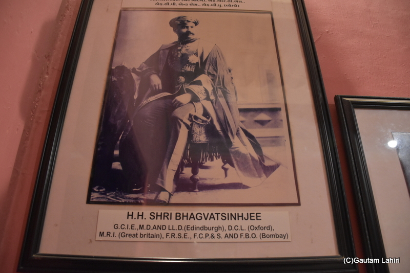 This is a photograph of the Maharaja, HH Shri Bhagvatsinhjee, an erudite scholar distinguished by the numerous degrees and titles he held, taken at Naulakha Palace in Gondal. The butt of his sword visible by gautam lahiri