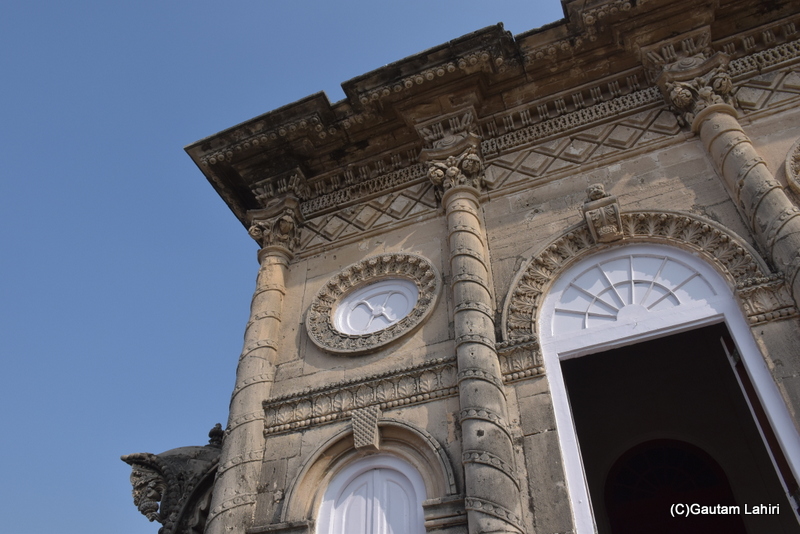 Ascending the steps to the terrace, we encountered a magnificently adorned room serving as the entrance to the inner quarters. The fusion of architecture was evident throughout, with European Gothic-style pillars merging with Asian engravings. This is the Naulakha Palace in Gondal, Gujarat. will take miles of observation to describe it bu gautam lahiri