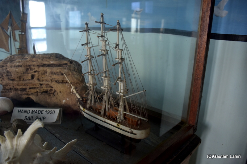 A beautifully created sail ship within its glass enclosure sat in one of the great rooms at Naulakha Palace, Gondal by gautam lahiri