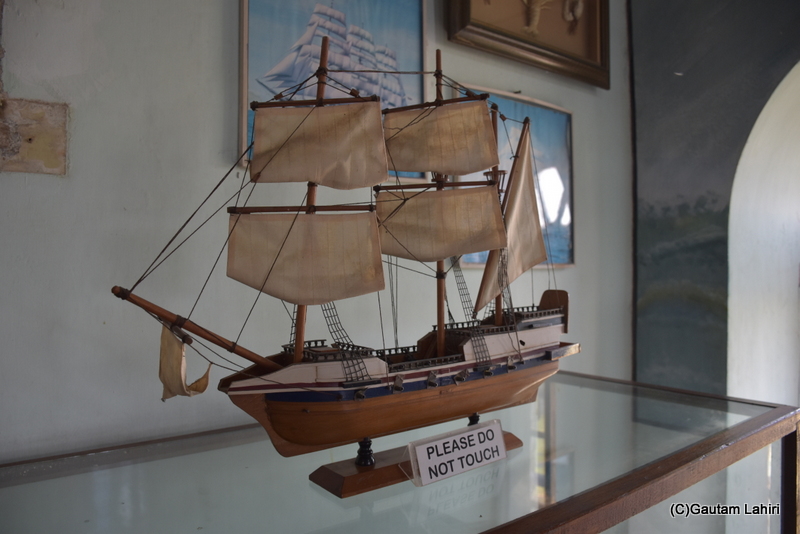 A brilliantly crafted sail ship in its full glory with all the sails pulled out, ready to sail, stood on a glass table at Naulakha Palace, Gondal by gautam lahiri