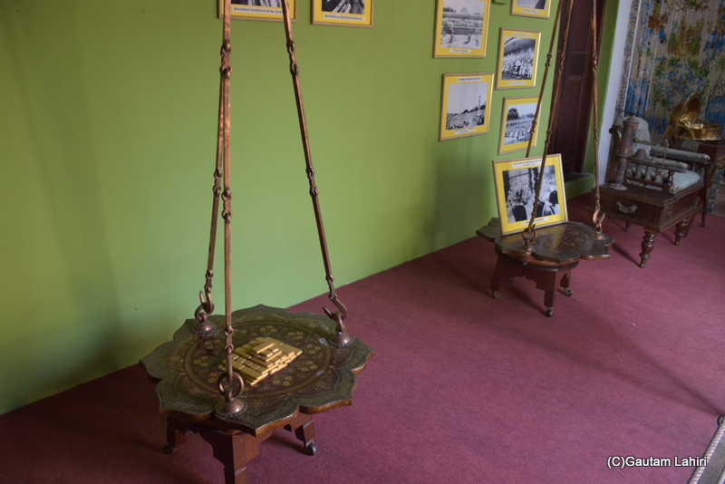 At Naulakha Palace, there is a robust balance designed to bear the weight of the Gondal king. The king would sit on one side, while an equivalent number of gold bars, matching his weight, were placed on the other. This act demonstrated the king's power, his rule, and his commitment to his subjects. Additionally, the royal family used this occasion to donate the gold to the poor and needy, signifying their benevolence towards their people, by gautam lahiri