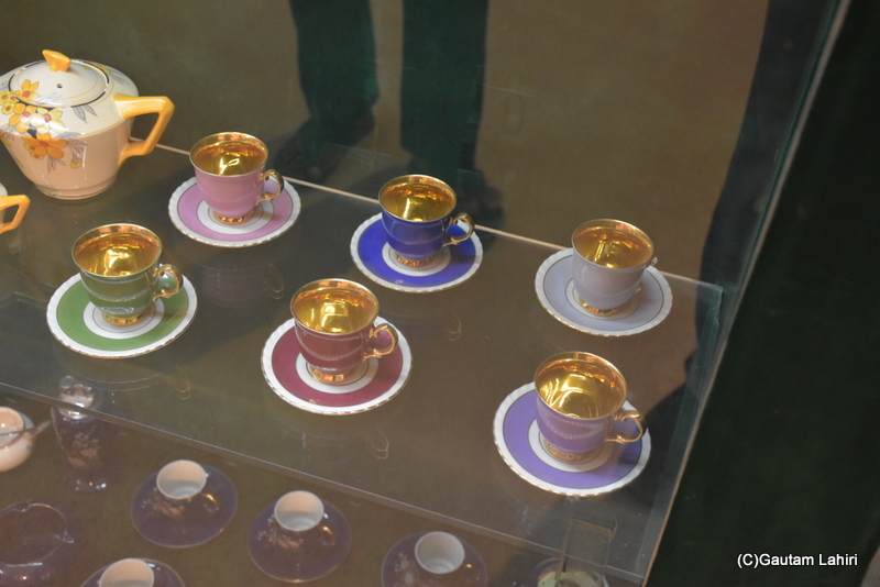 Gold plated cups, with multicolored plates and designs looked fabulous on its glass support at Naulakha Palace, Gondal by gautam lahiri
