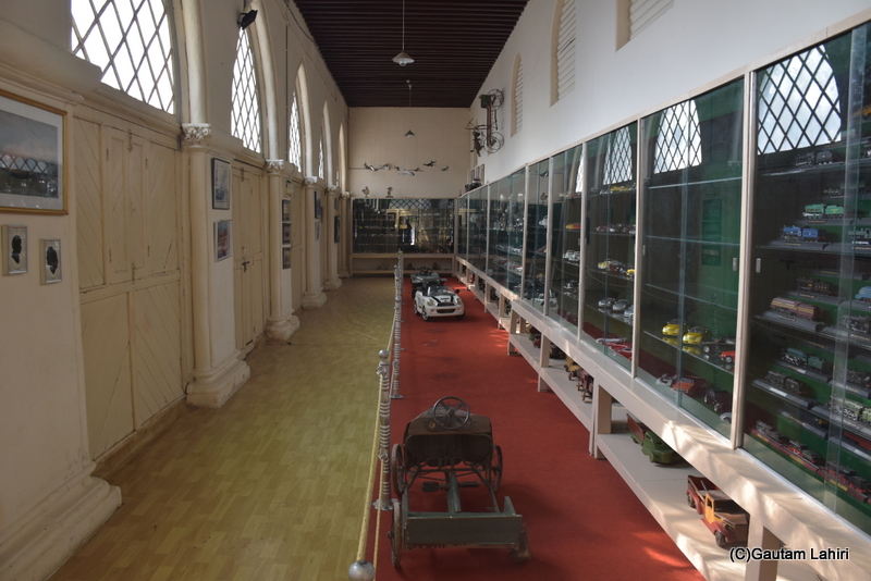 We reached the end of the extensive display room, home to an impressive array of models. The Victorian arches cast the afternoon light, causing the models to radiate within the Naulakha Palace by gautam lahiri