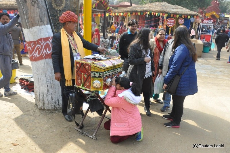 Local film shows of static pics with music at SurajKund Exhibition by gautam lahiri